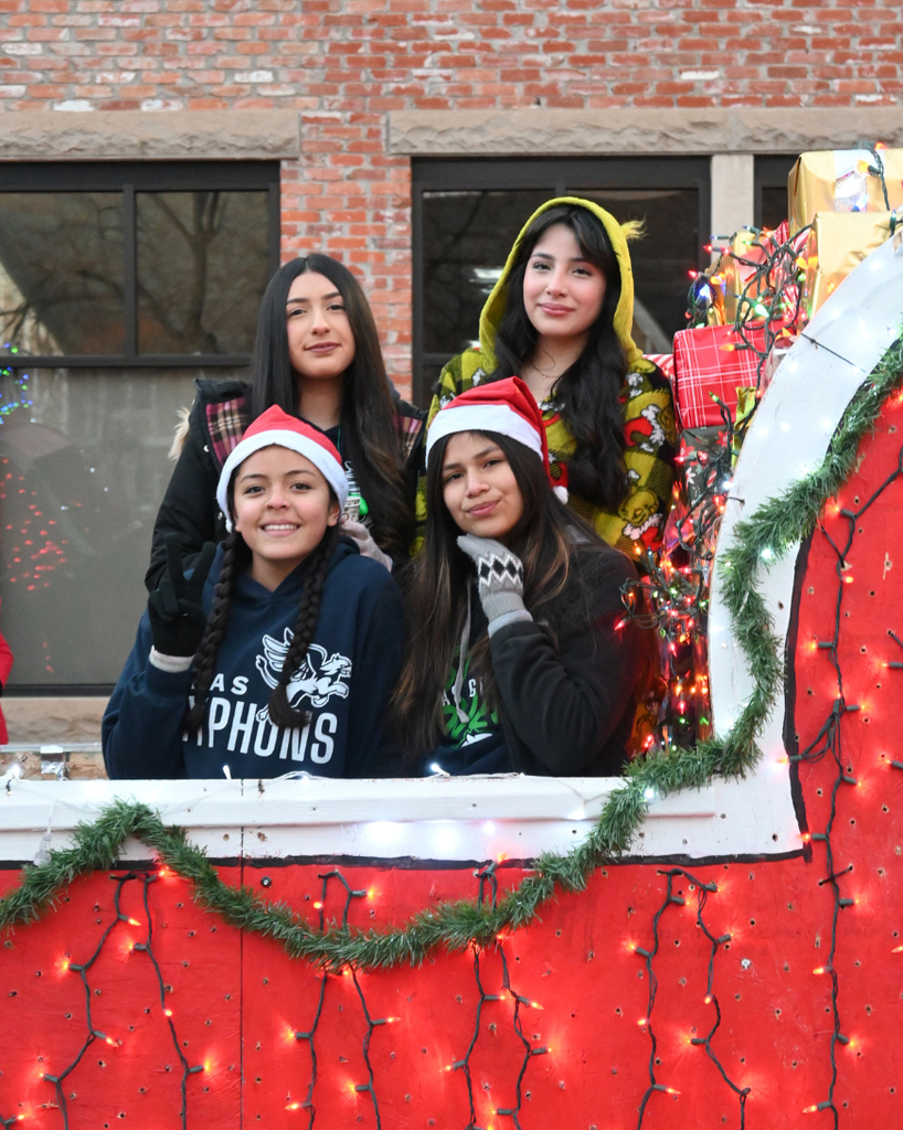 four girls smile on atlas float