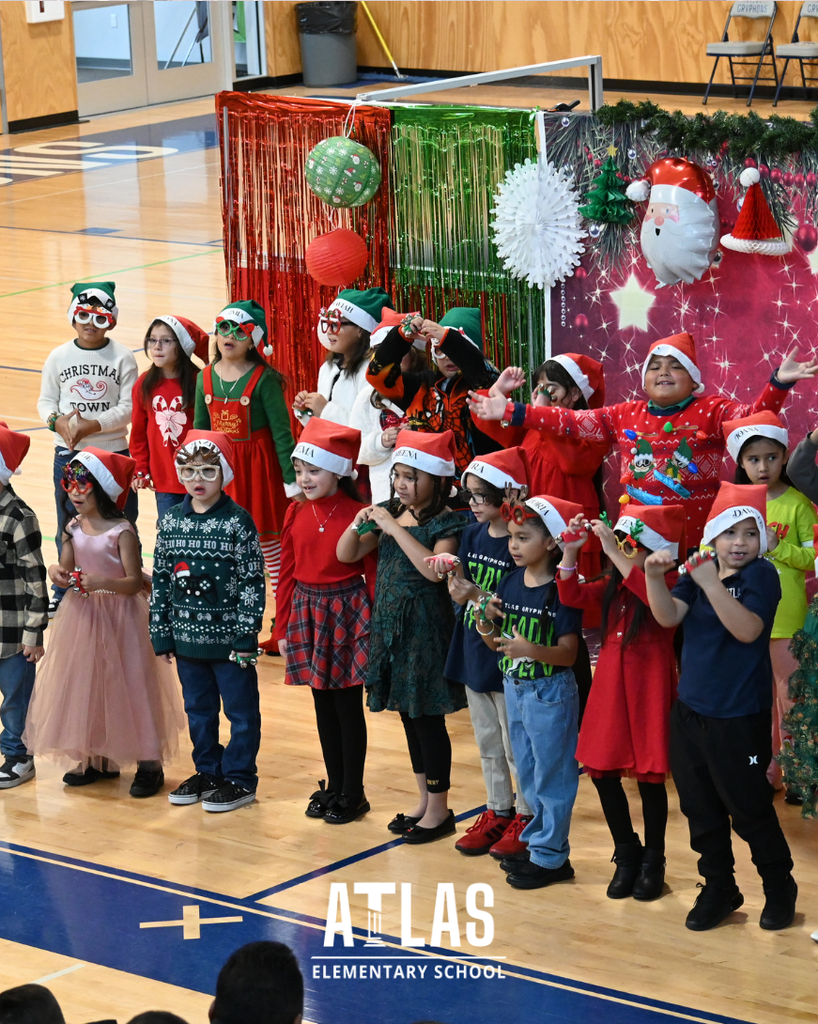 students smile while singing in holiday attire