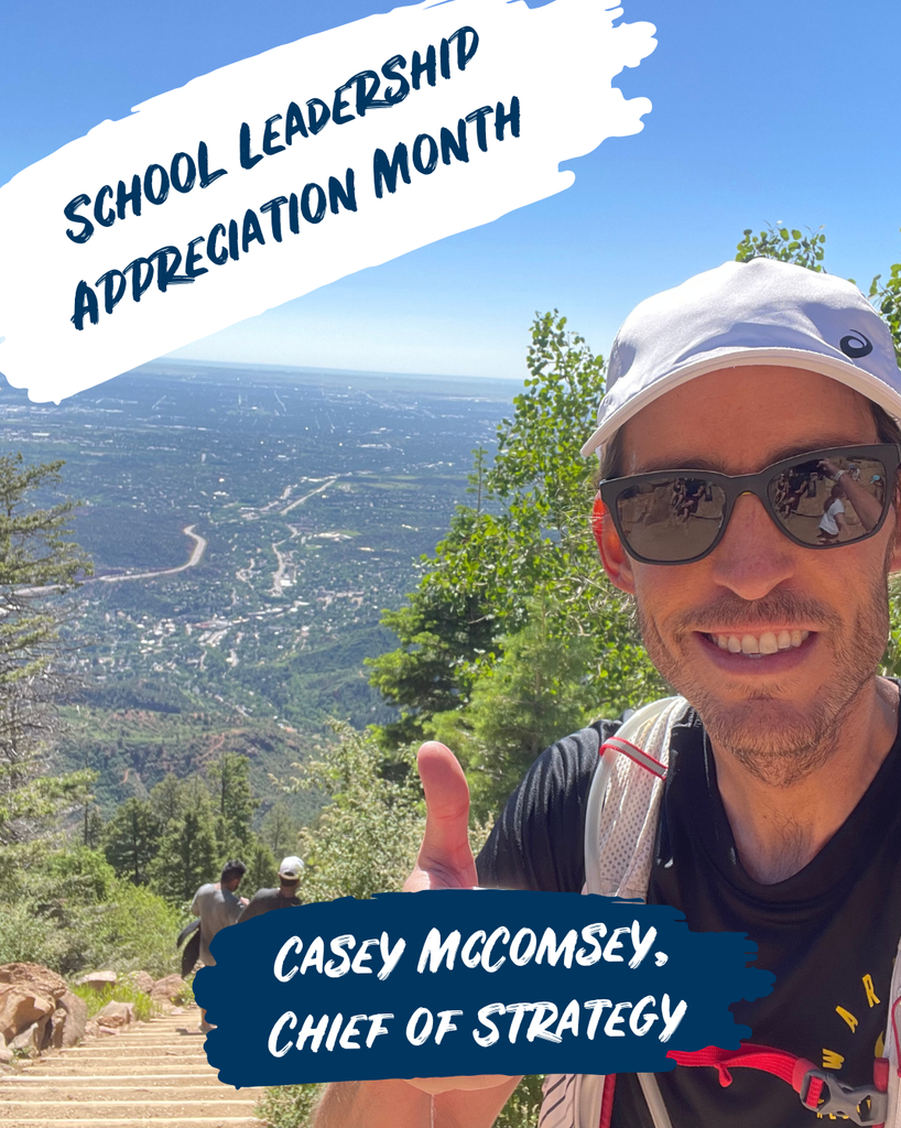 Casey, chief of strategy, smiles at the top of the manitou inclne