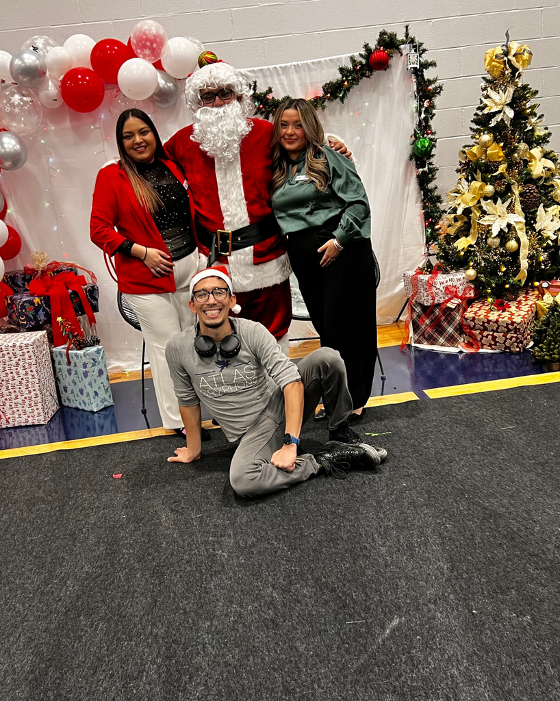 Giselle, David and Nicole smile with Santa