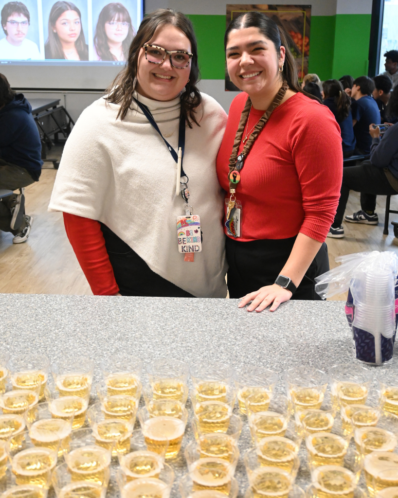 two school counselors smile