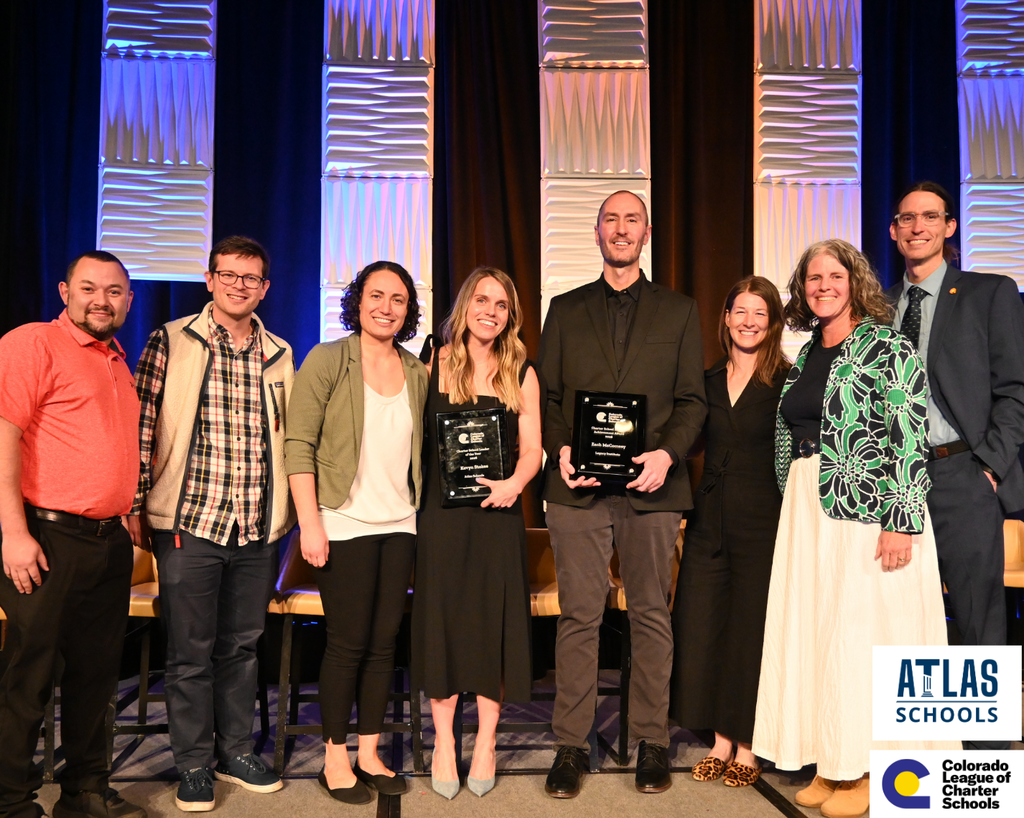 Winners stand with Atlas staff