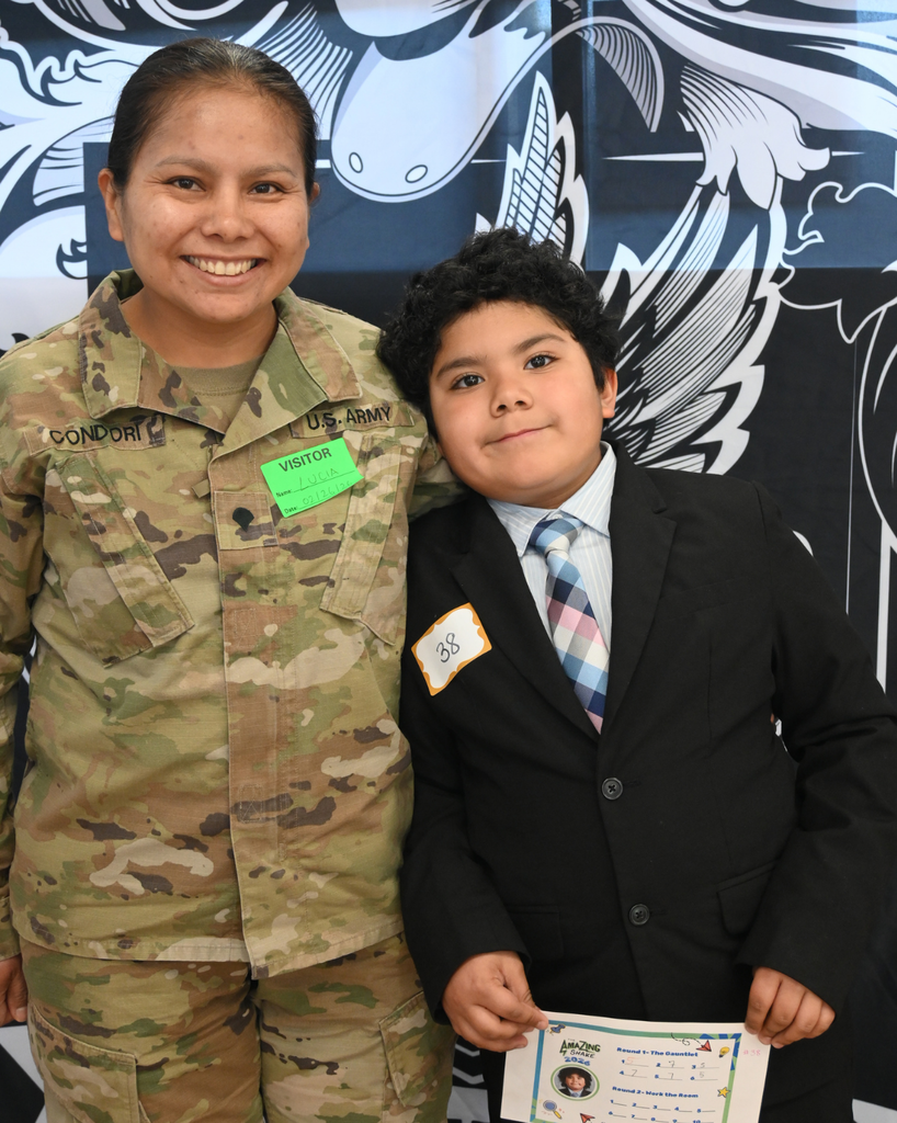 student smiles with community member