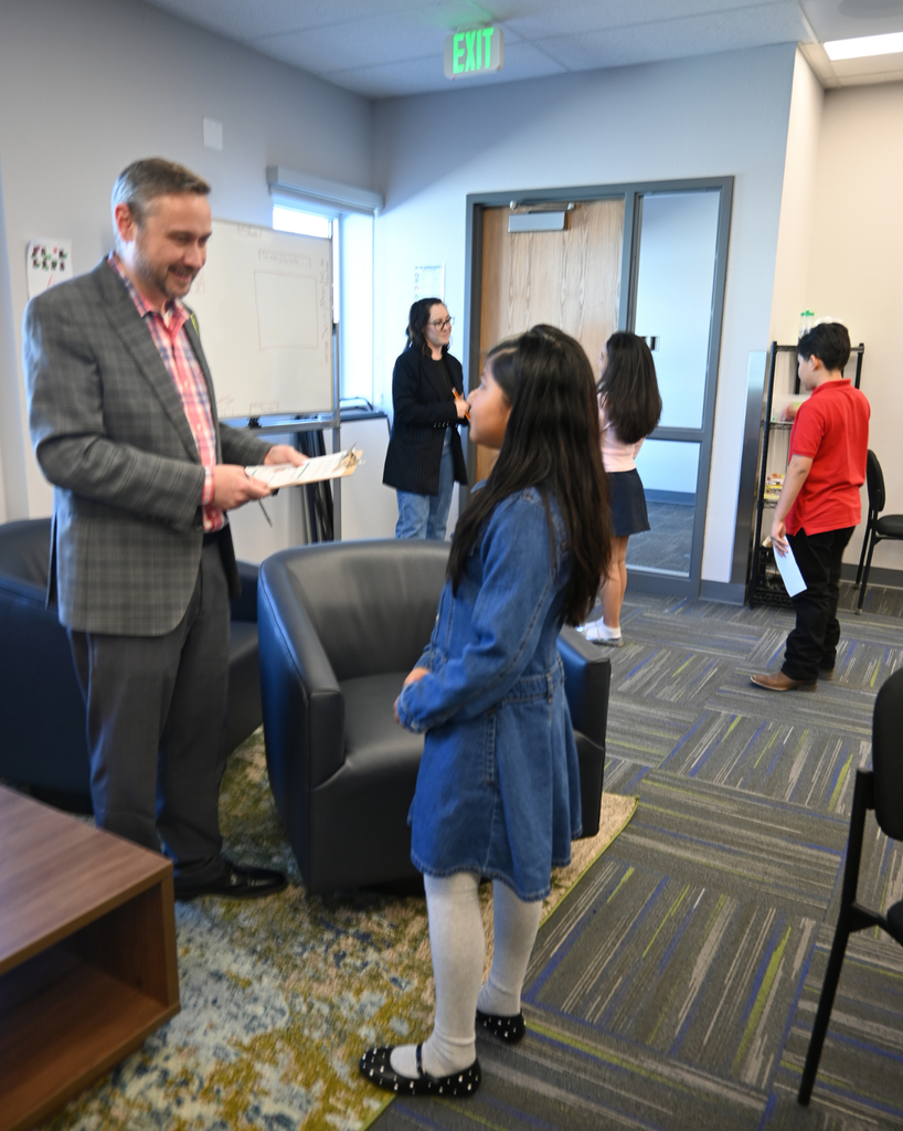 student smiles with community member