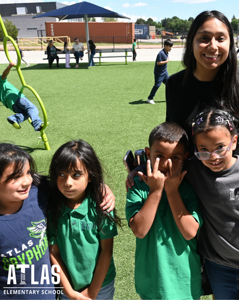 students smile with teacher