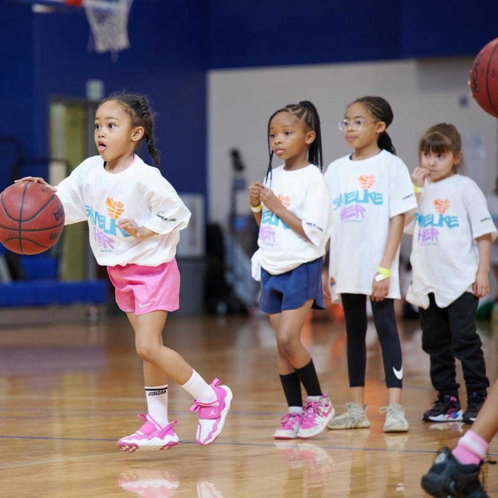 girls play basketball