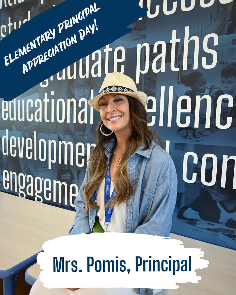 Teacher smiles with hat one