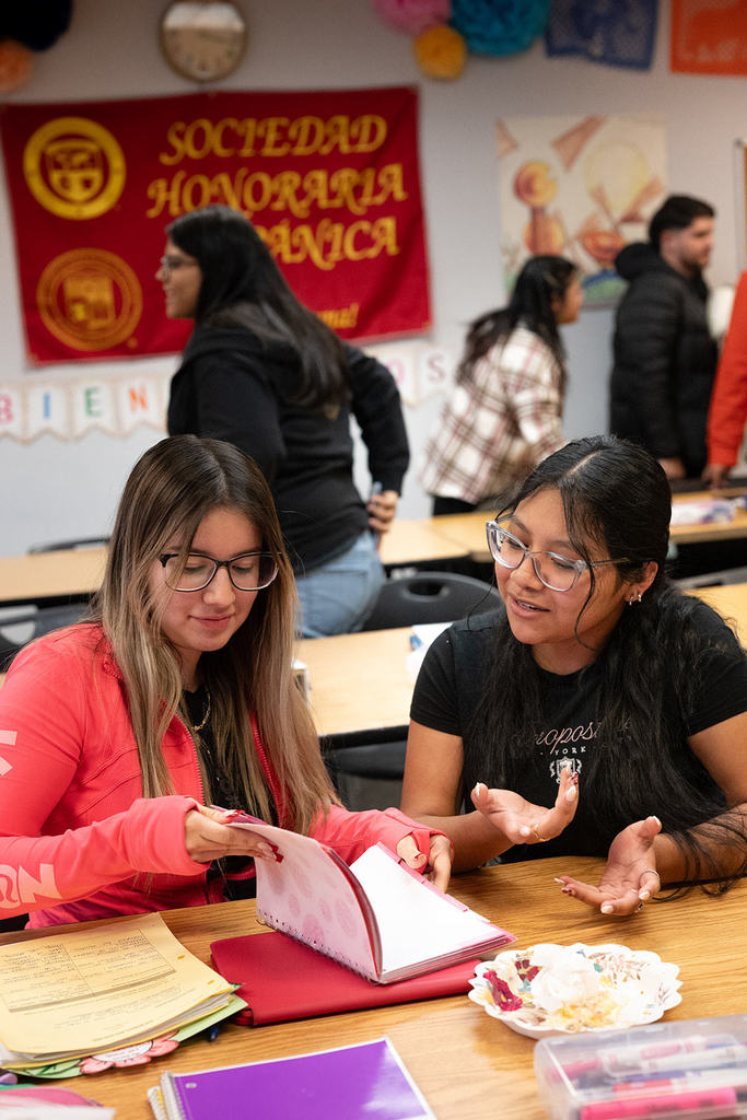students smile while working on homework