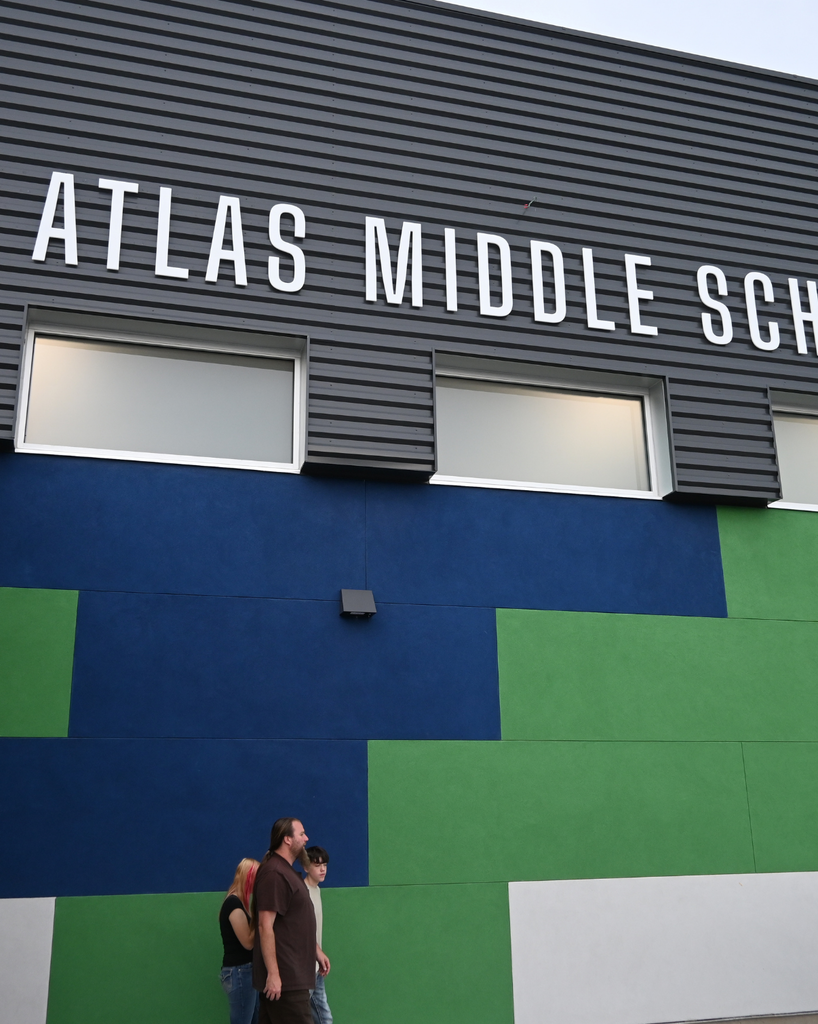 People walk the middle school building