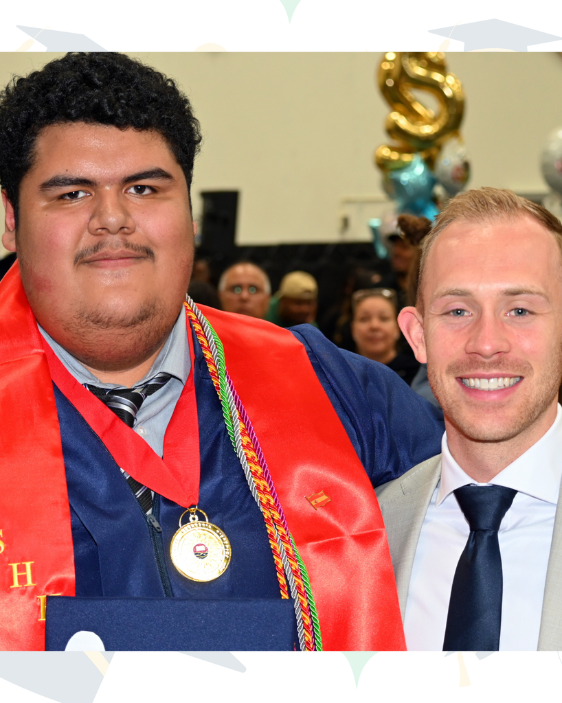 graduate with teacher smile