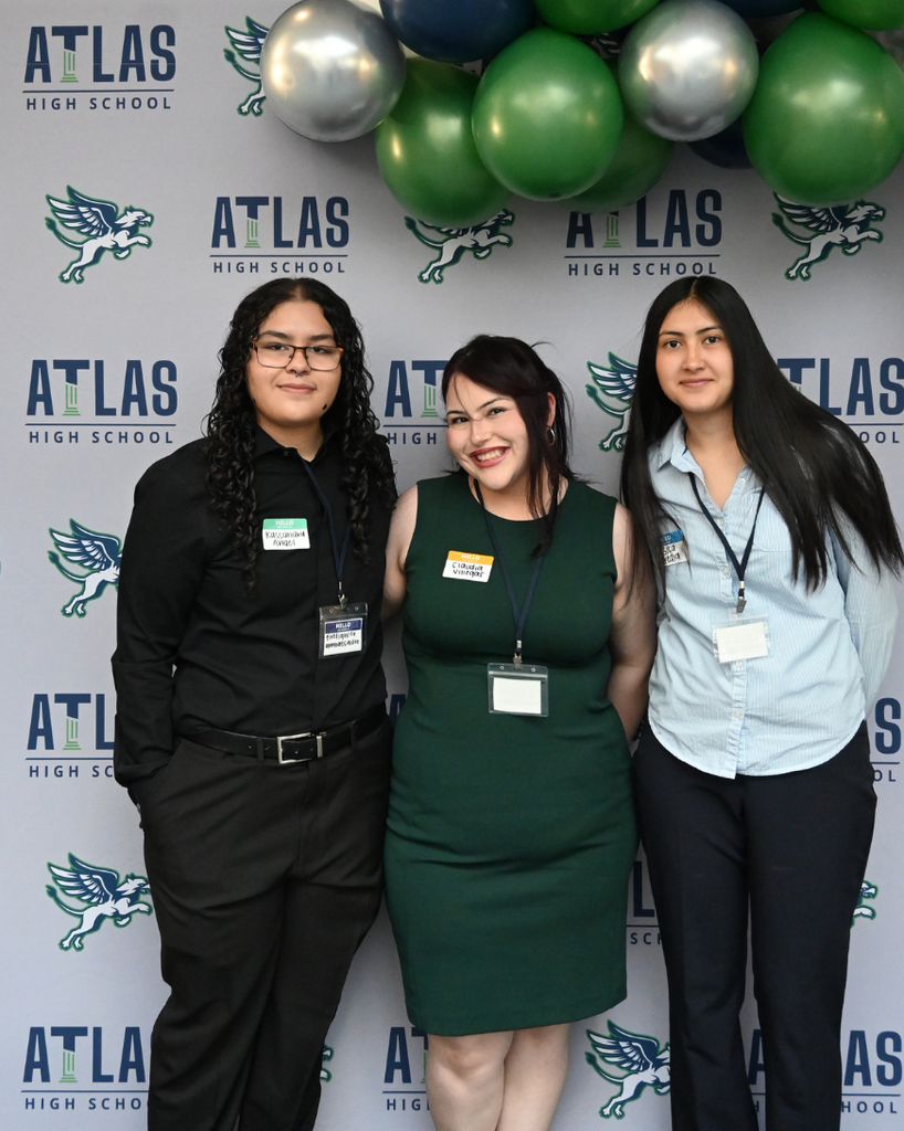 three students smile