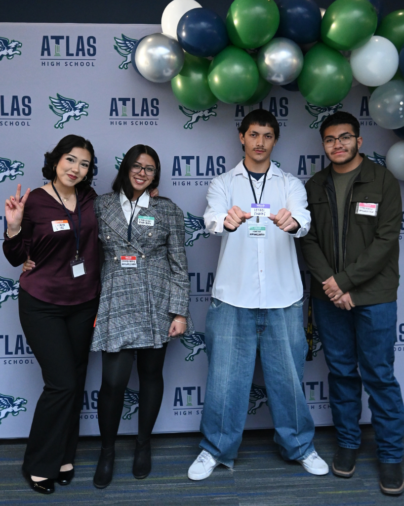 four students smile