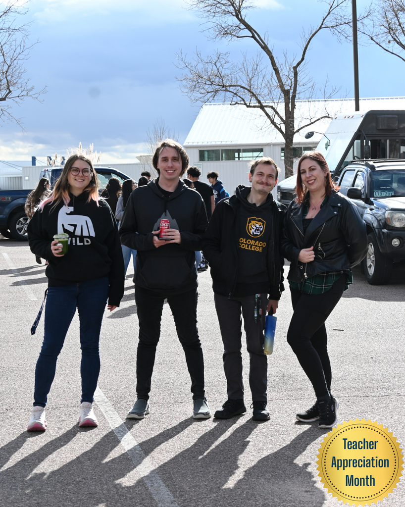four teachers smile