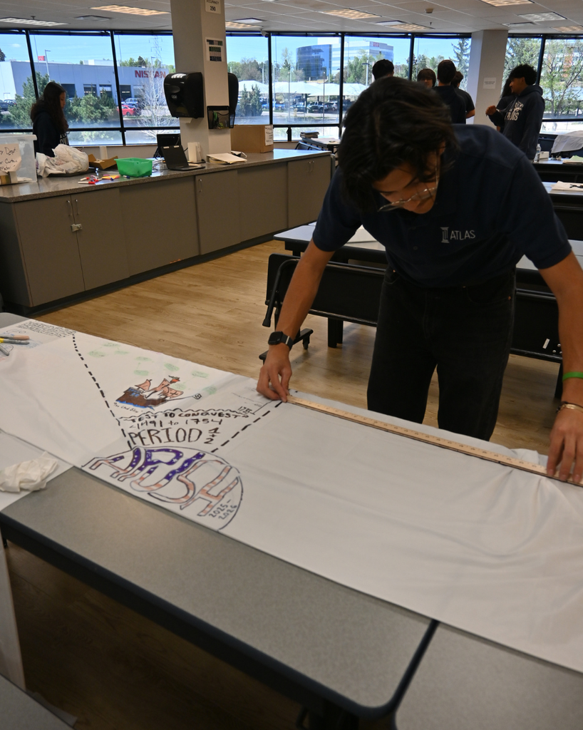 student works on shower curtain project