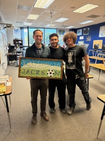 students smile with mosaics and teachers