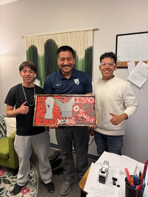 students smile with mosaics and teachers