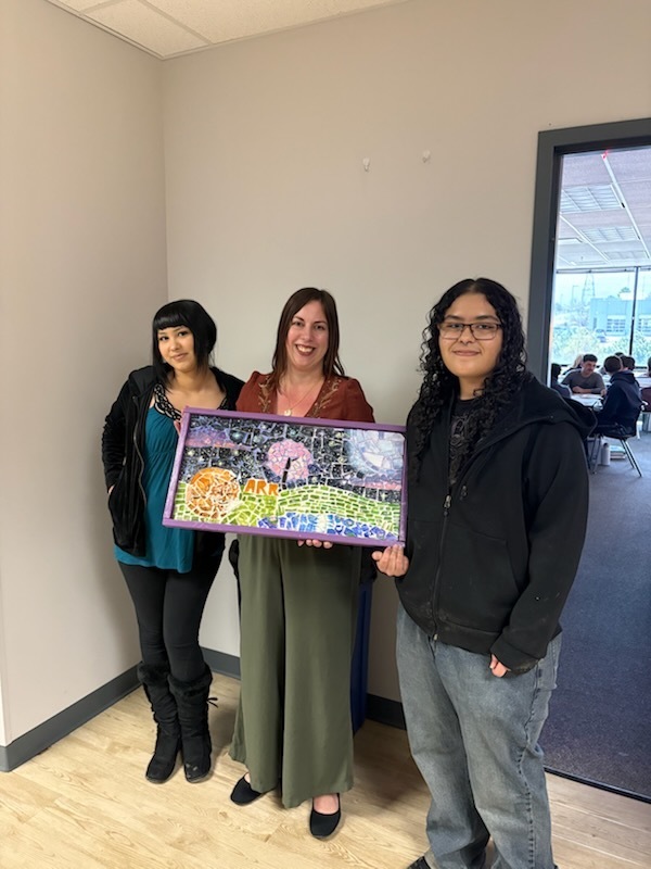 students smile with mosaics and teachers