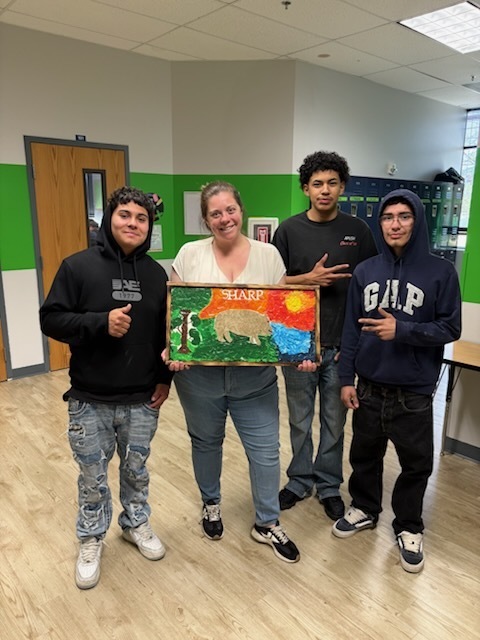 students smile with mosaics and teachers