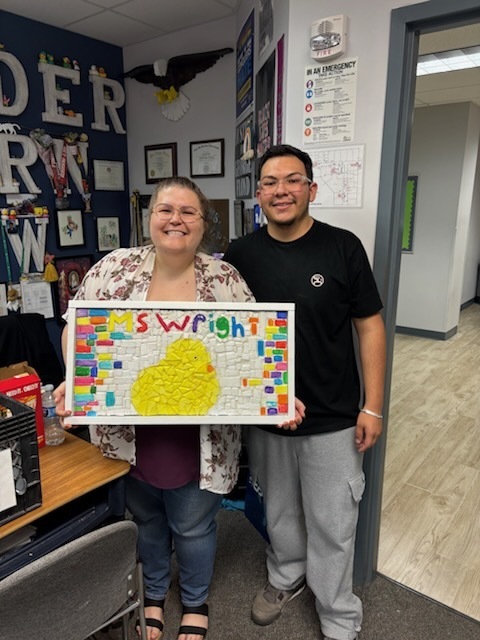 students smile with mosaics and teachers