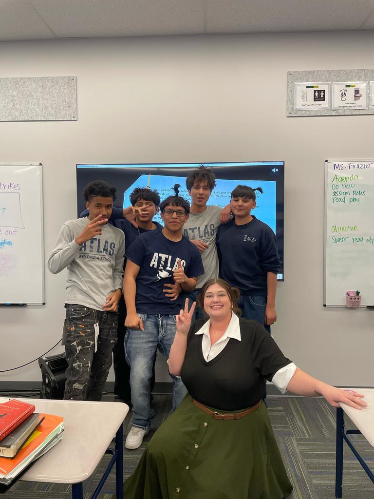 students smile with teacher