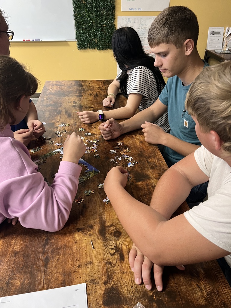 STUDENTS COMPLETING A PUZZLE
