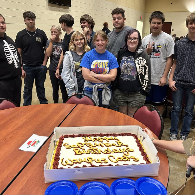 students with birthday cake