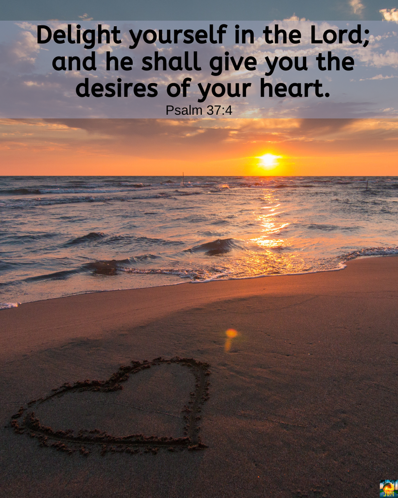 Heart shape in the sand on a beach with the setting sun on the horizon; Delight yourself in the Lord; and he shall give you the desires of your heart. (Psalm 37:4)