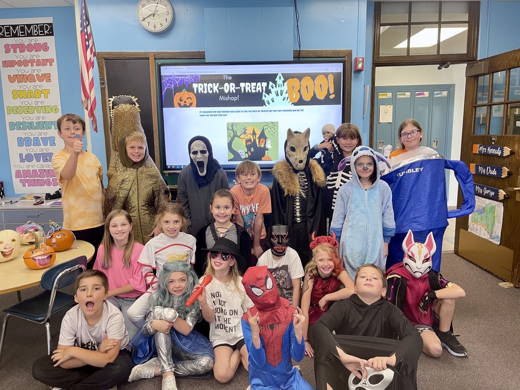 Fourth graders are pictured Thursday completing their academic escape room activity. 