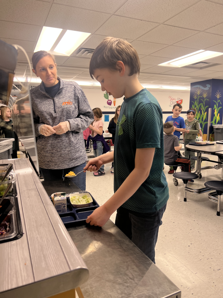 Scenes from build-a-salad plate day March 18 at Attica Elementary School.