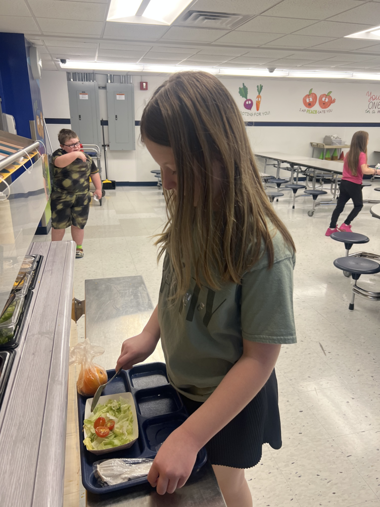Scenes from build-a-salad plate day March 18 at Attica Elementary School.