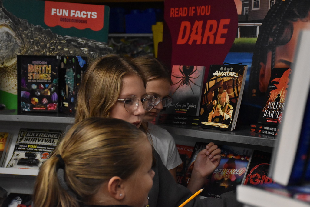 Attica Middle School students are pictured exploring the Scholastic Book Fair last week. 