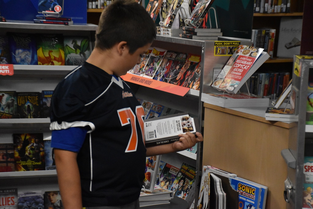 Attica Middle School students are pictured exploring the Scholastic Book Fair last week. 