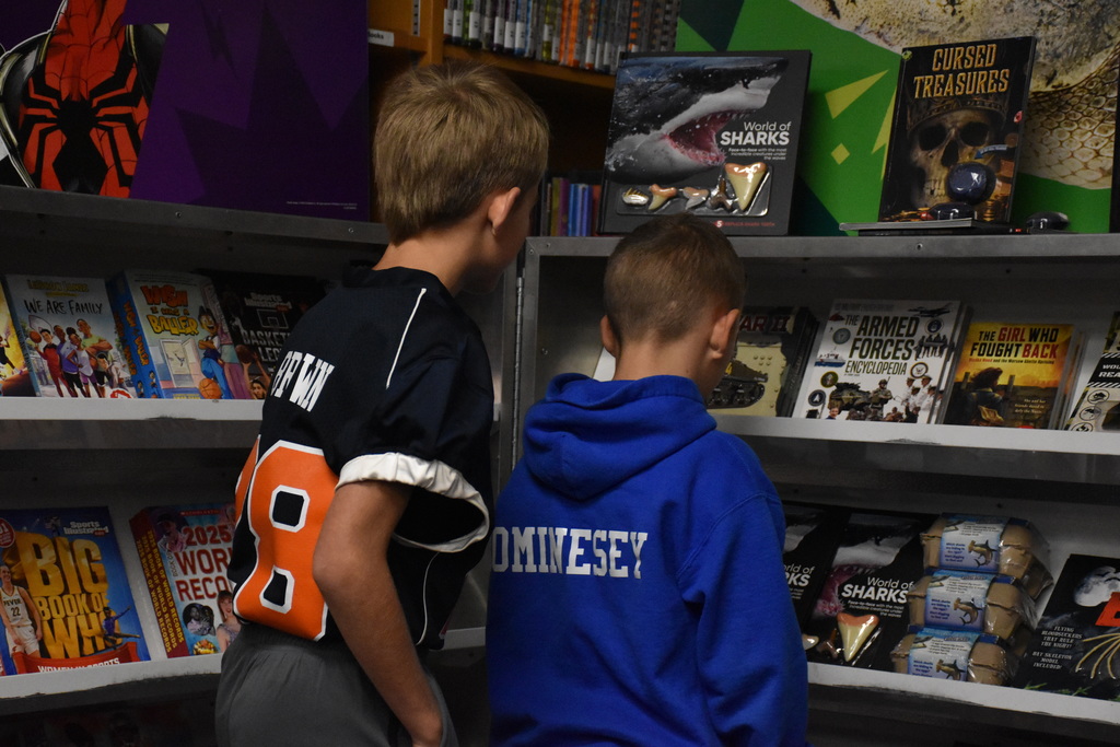 Attica Middle School students are pictured exploring the Scholastic Book Fair last week. 