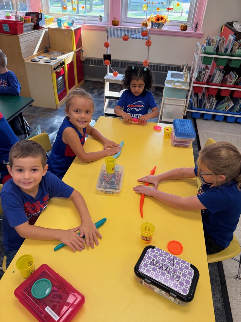 Mrs. Audra Landis’s kindergarten students are pictured practicing how to use common school supplies such as like playdoh, scissors, glue, dice, markers, pencils and crayons.