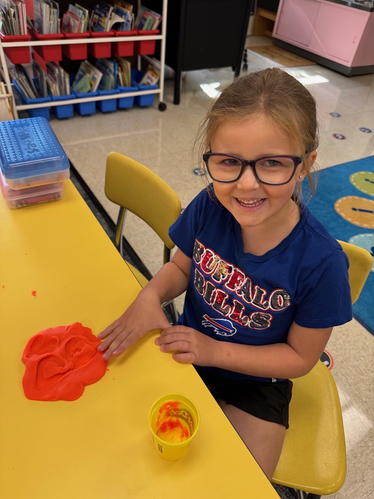 Mrs. Audra Landis’s kindergarten students are pictured practicing how to use common school supplies such as like playdoh, scissors, glue, dice, markers, pencils and crayons.