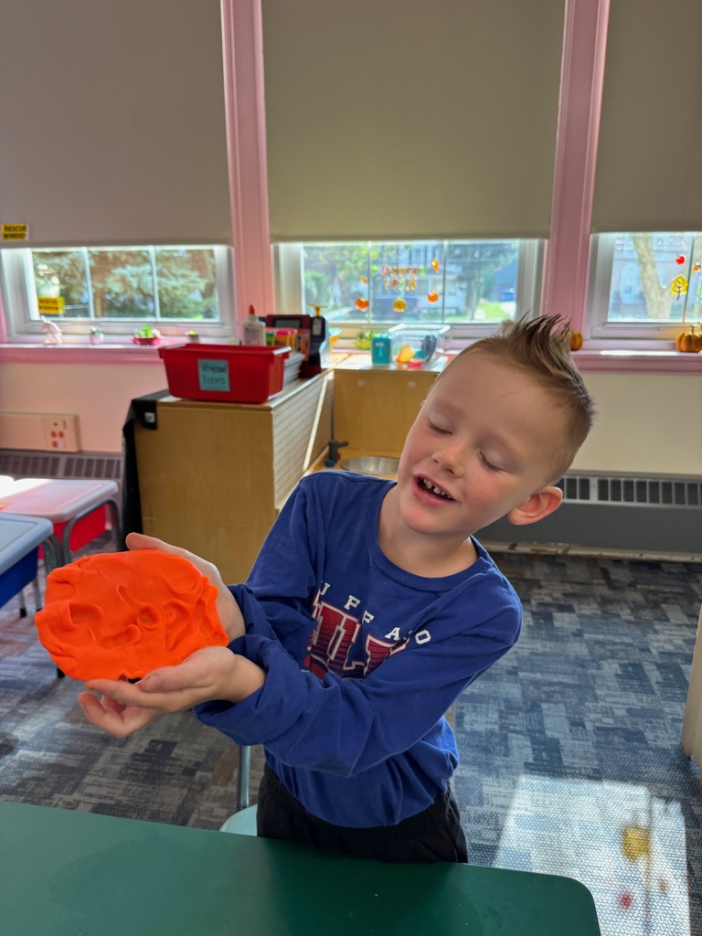 Mrs. Audra Landis’s kindergarten students are pictured practicing how to use common school supplies such as like playdoh, scissors, glue, dice, markers, pencils and crayons.
