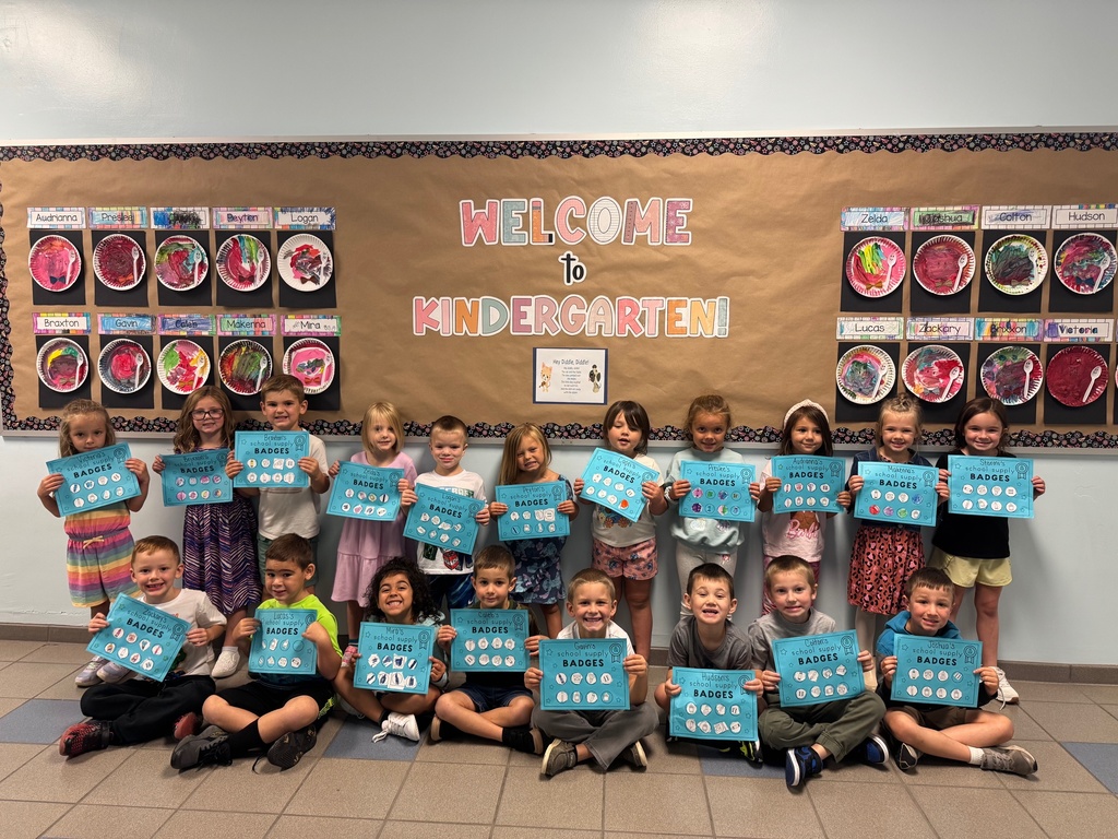 Mrs. Audra Landis’s kindergarten students are pictured practicing how to use common school supplies such as like playdoh, scissors, glue, dice, markers, pencils and crayons.