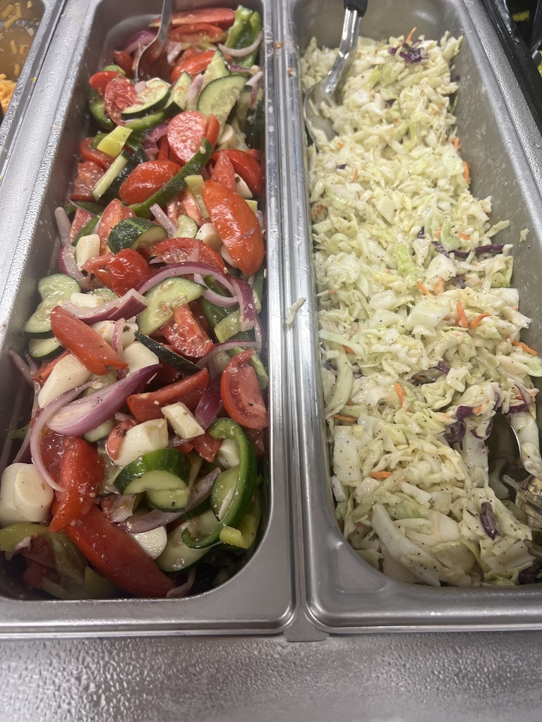 Jill Pierce’s students are pictured harvesting and distributing vegetables for our food service program. 