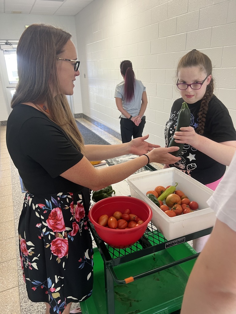 Jill Pierce’s students are pictured harvesting and distributing vegetables for our food service program. 
