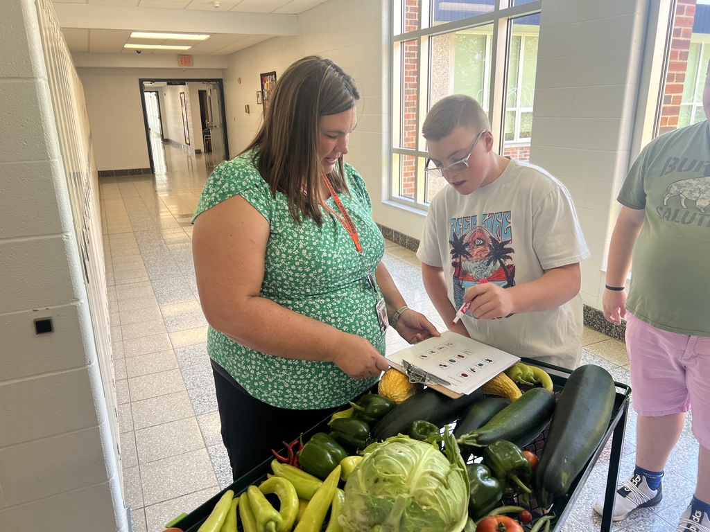 Jill Pierce’s students are pictured harvesting and distributing vegetables for our food service program. 