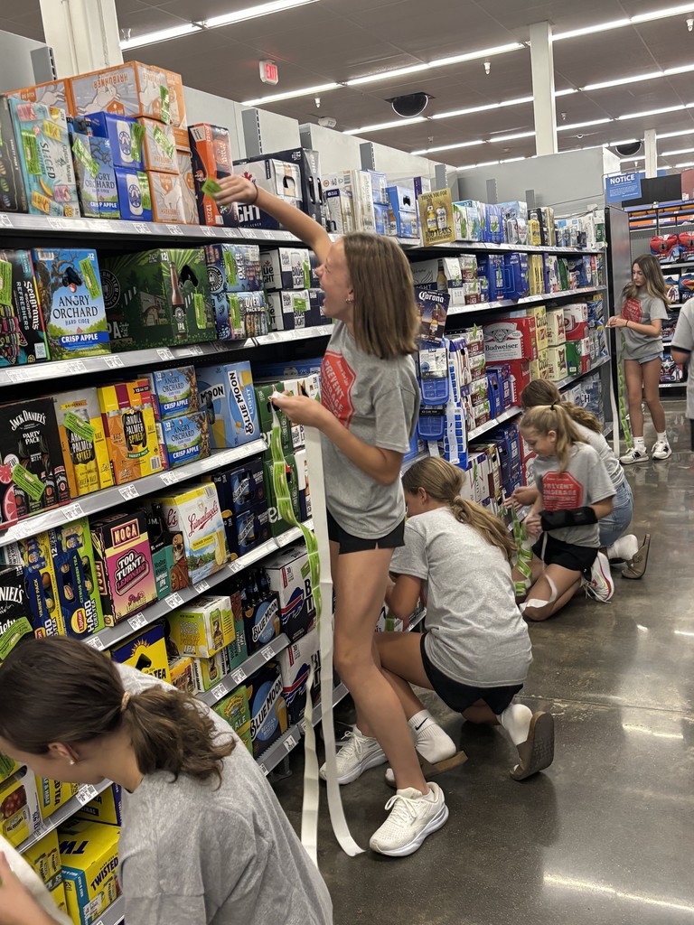 Attica sixth graders are pictured participating in Project Sticker Shock yesterday. 