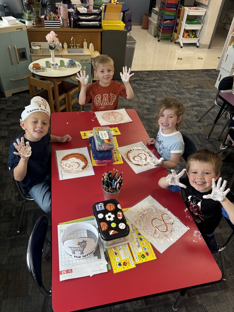 Kristin Janes’ kindergarten students are pictured practicing writing numbers in shaving cream.