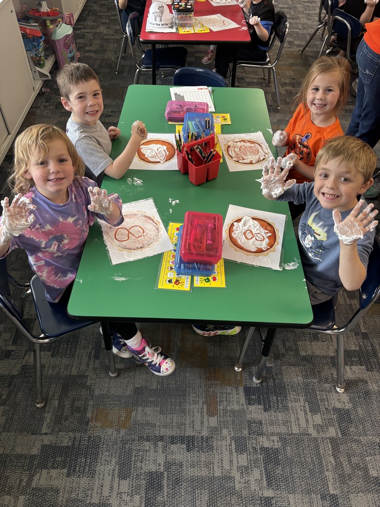Kristin Janes’ kindergarten students are pictured practicing writing numbers in shaving cream.