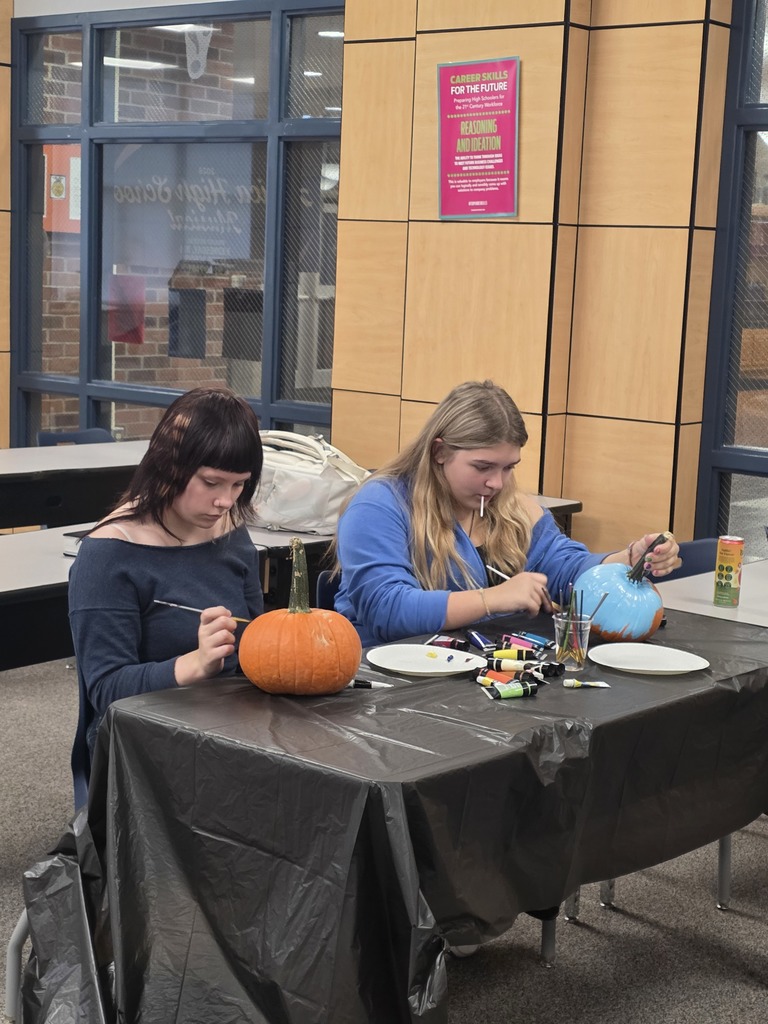 Scenes from pumpkin painting in the High School Library Friday. 