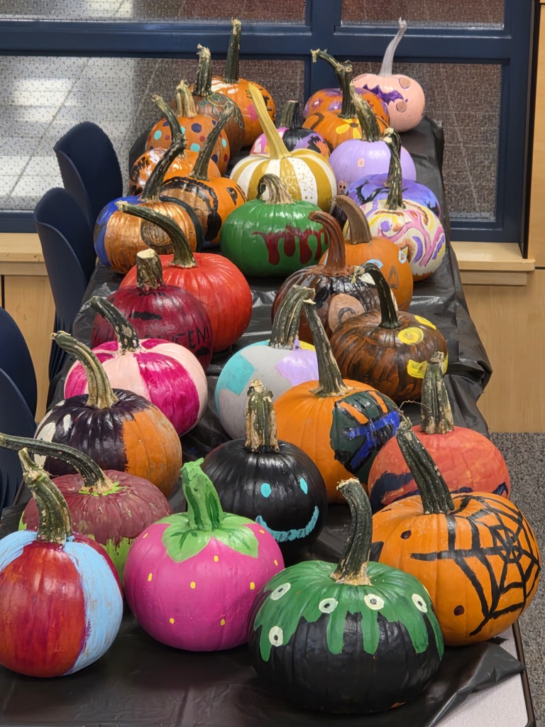 Scenes from pumpkin painting in the High School Library Friday. 