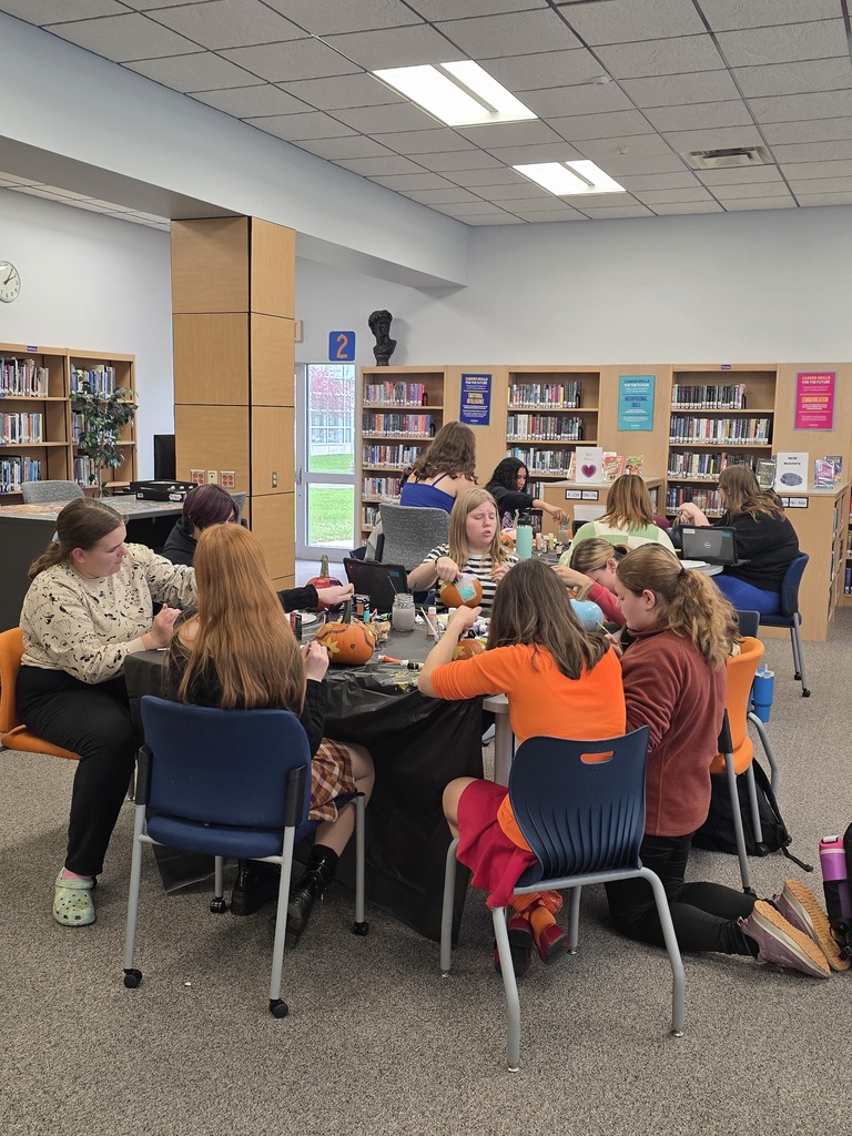 Scenes from pumpkin painting in the High School Library Friday. 