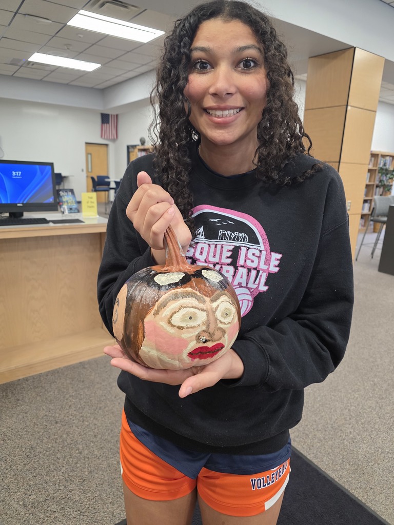 Scenes from pumpkin painting in the High School Library Friday. 