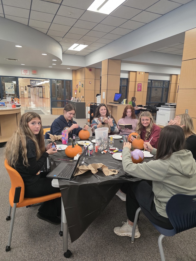 Scenes from pumpkin painting in the High School Library Friday. 