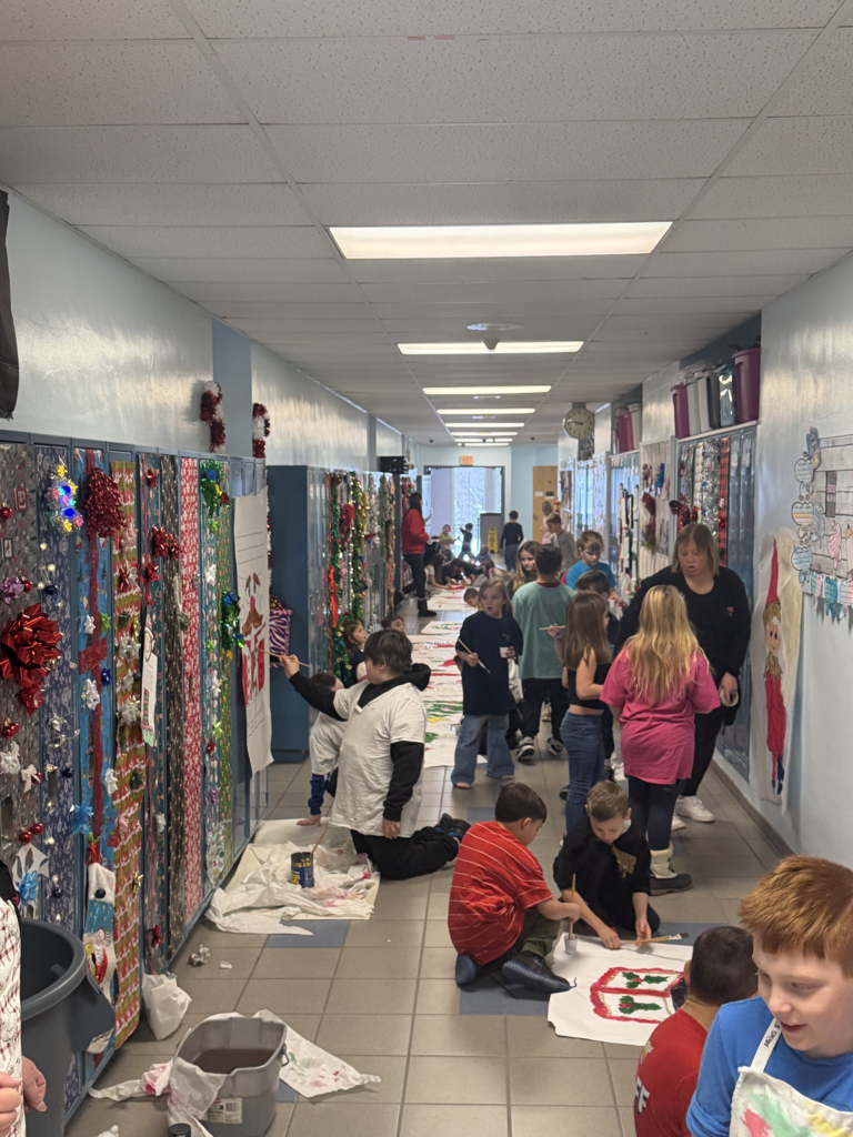 Scenes from third graders’ hallway decorating last week at Attica Elementary. 