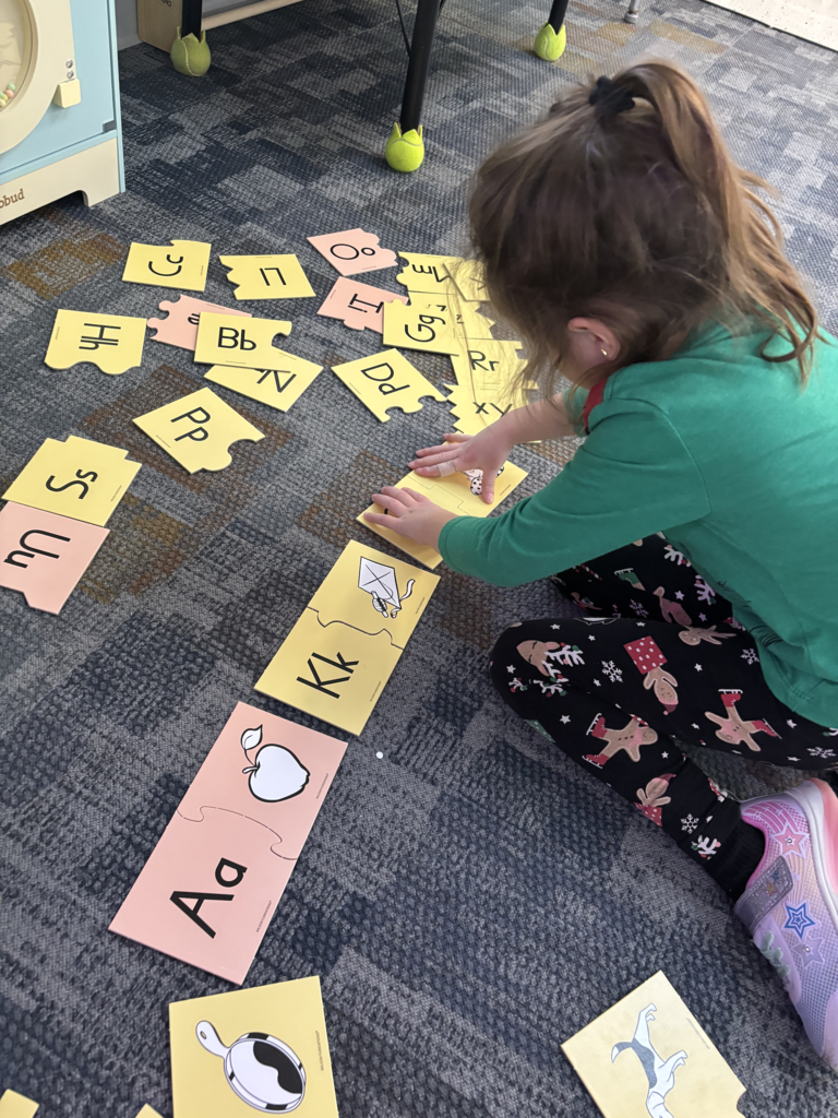 Scenes from kindergarteners’ letter games activities earlier this week. 